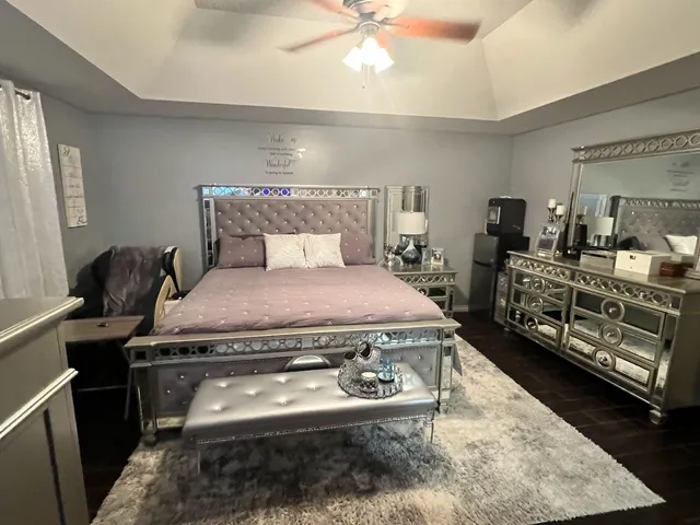 a bedroom with a bed and furniture