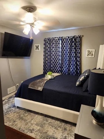 a bathroom with a glass shower door and a window