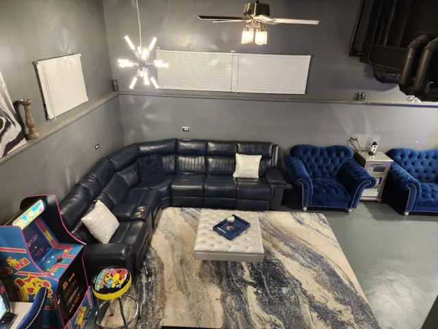 a view of a room with wooden floor and furniture