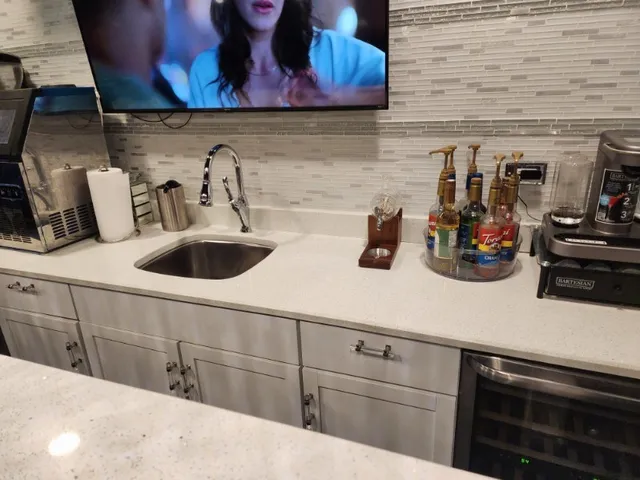 a living room with furniture a ceiling fan and a rug