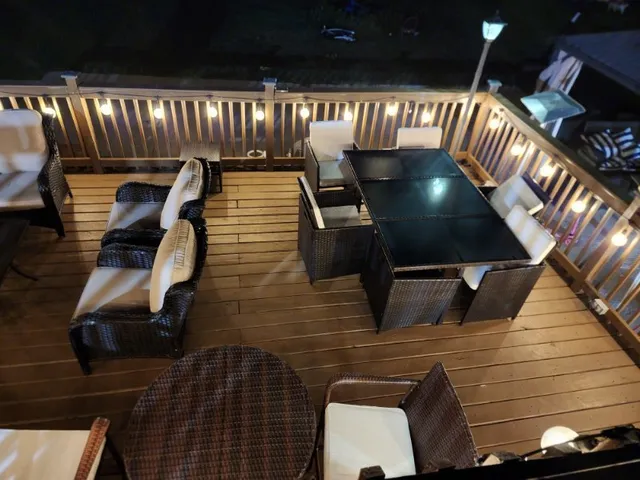 a dining room with furniture and wooden floor