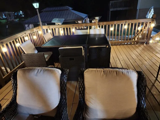 an outdoor space with furniture and umbrella