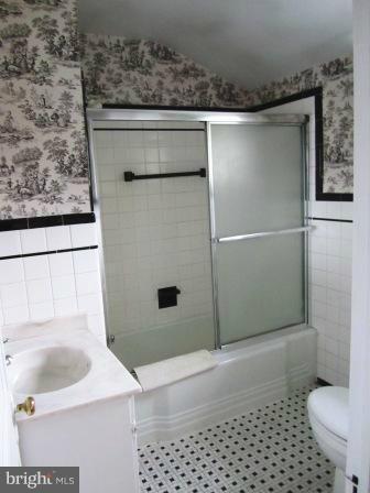 3009 Dunran Road Dundalk, MD 21222 - Photo 9 of 26 a bathroom with a sink toilet and shower