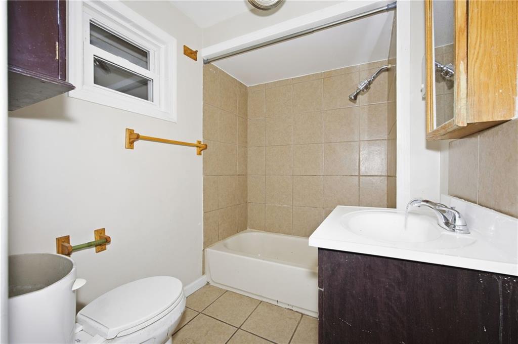764 Mary Street McKees Rocks, PA 15136 - Photo 12 of 25 a bathroom with a sink a toilet and shower