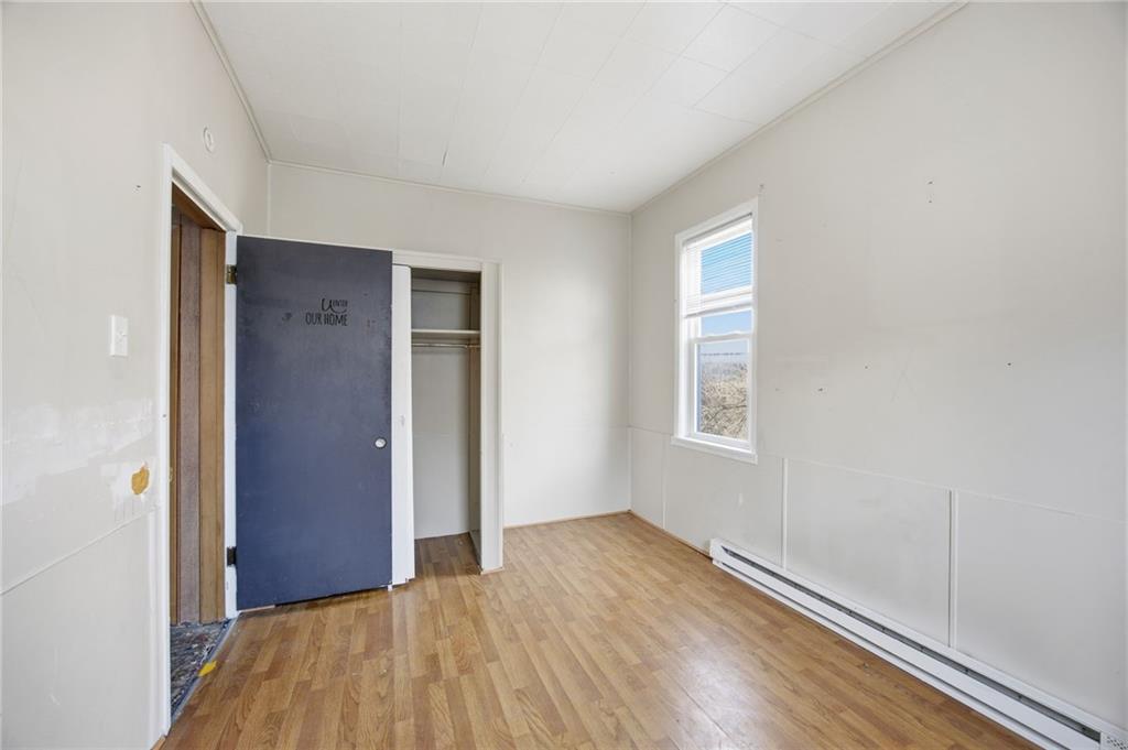 764 Mary Street McKees Rocks, PA 15136 - Photo 15 of 25 an empty room with wooden floor and windows