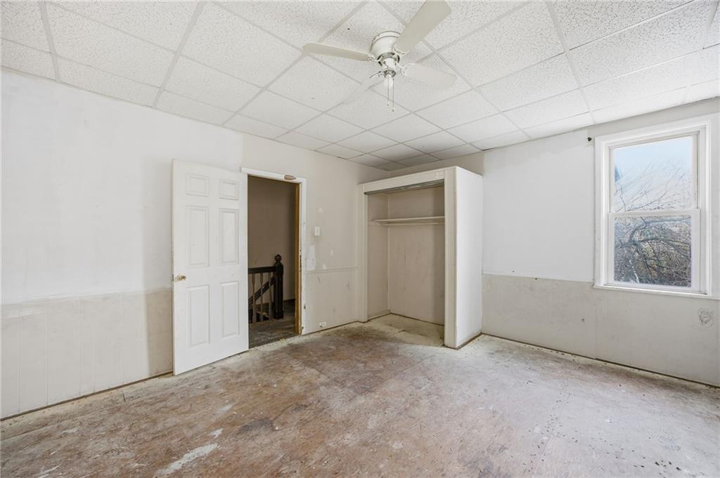 764 Mary Street McKees Rocks, PA 15136 - Photo 17 of 25 en empty room with windows and closet