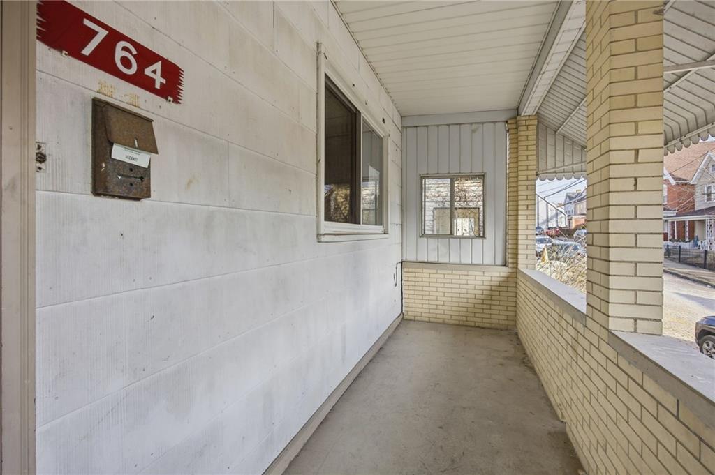 764 Mary Street McKees Rocks, PA 15136 - Photo 4 of 25 a view of a hallway with windows
