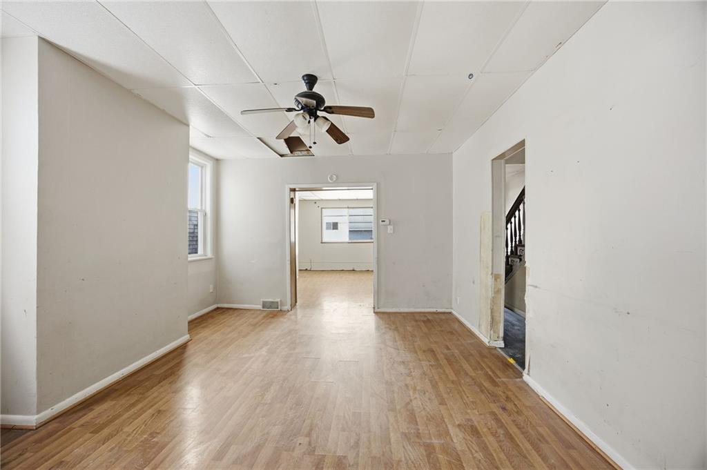 764 Mary Street McKees Rocks, PA 15136 - Photo 6 of 25 a view of empty room with wooden floor and window