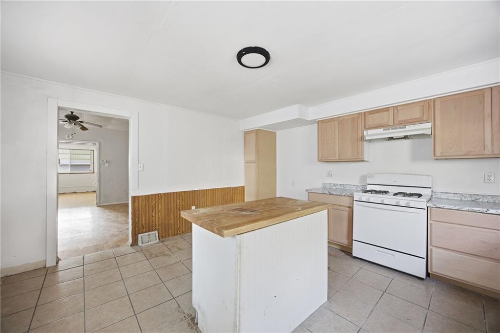 764 Mary Street McKees Rocks, PA 15136 - Photo 10 of 25 a kitchen with cabinets and white appliances