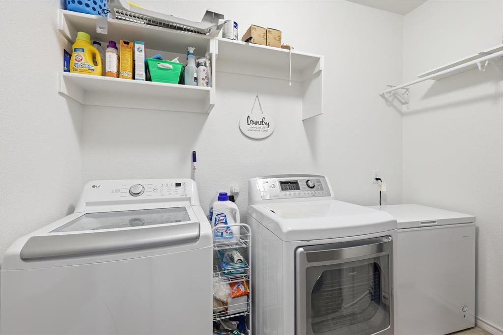 11500 Starlight Ranch Fort Worth, TX 76052 - Photo 30 of 40 Dedicated laundry area with white walls and built-in shelving