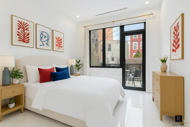 a kitchen with a table chairs refrigerator and sink