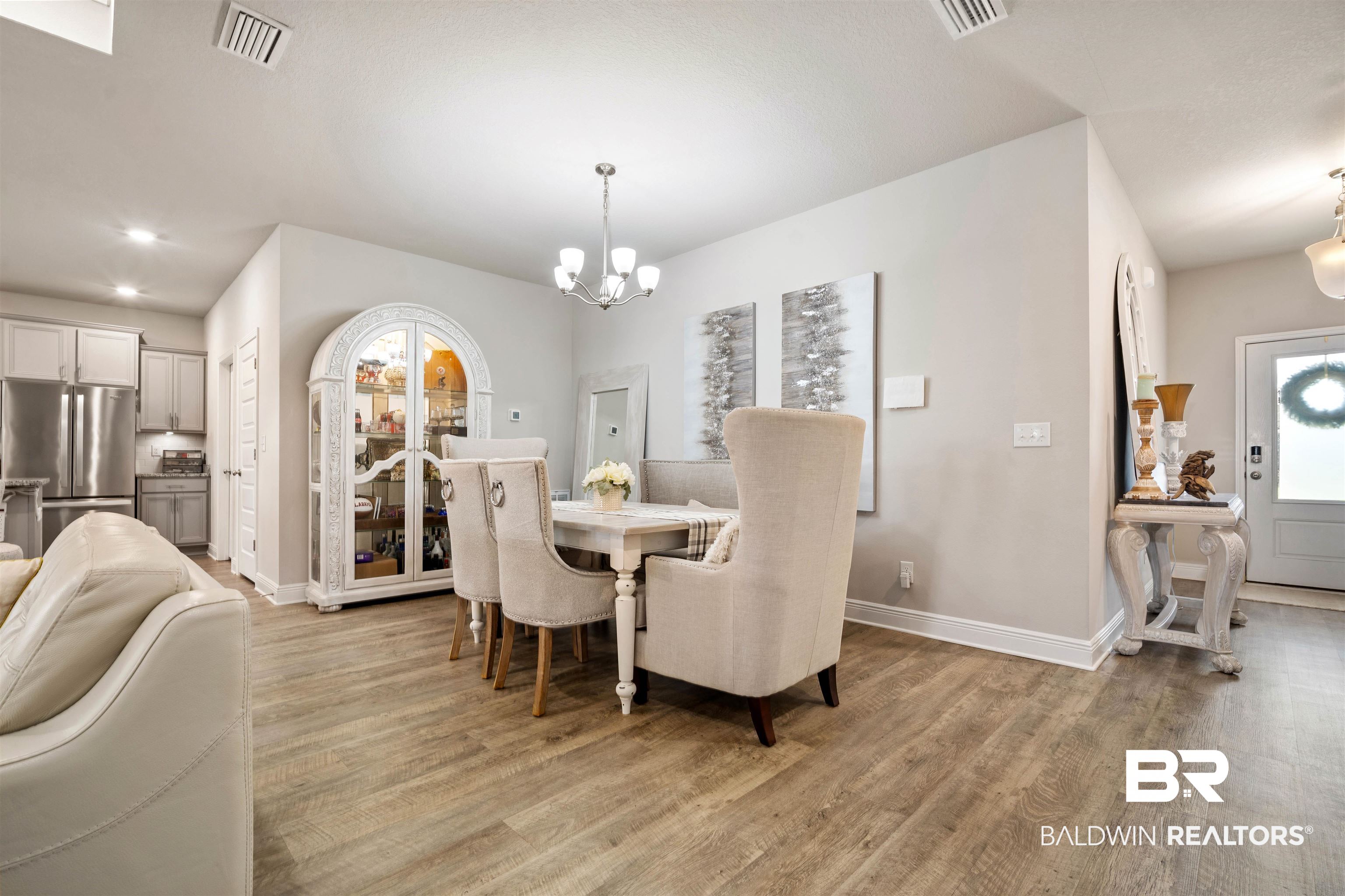 10474 Loamy Avenue Mobile, AL 36695 - Photo 7 of 31 Dining room with light wood-type flooring and a chandelier