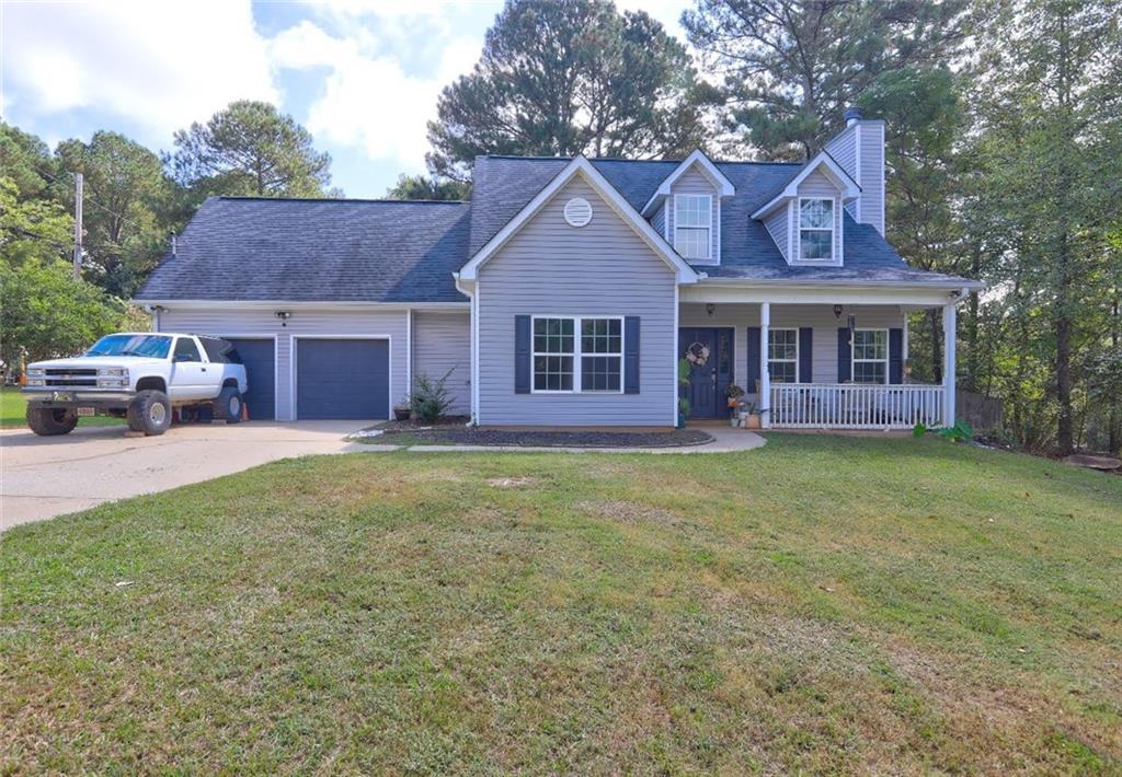 11489 Highway 36 Covington, GA 30014 - Photo 1 of 1 a front view of a house with garden