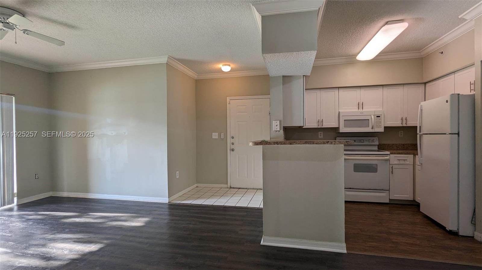 160 Southwest 117th Terrace, Unit 6106 Pembroke Pines, FL 33025 - Photo 11 of 28 a kitchen with stainless steel appliances a refrigerator and a stove top oven