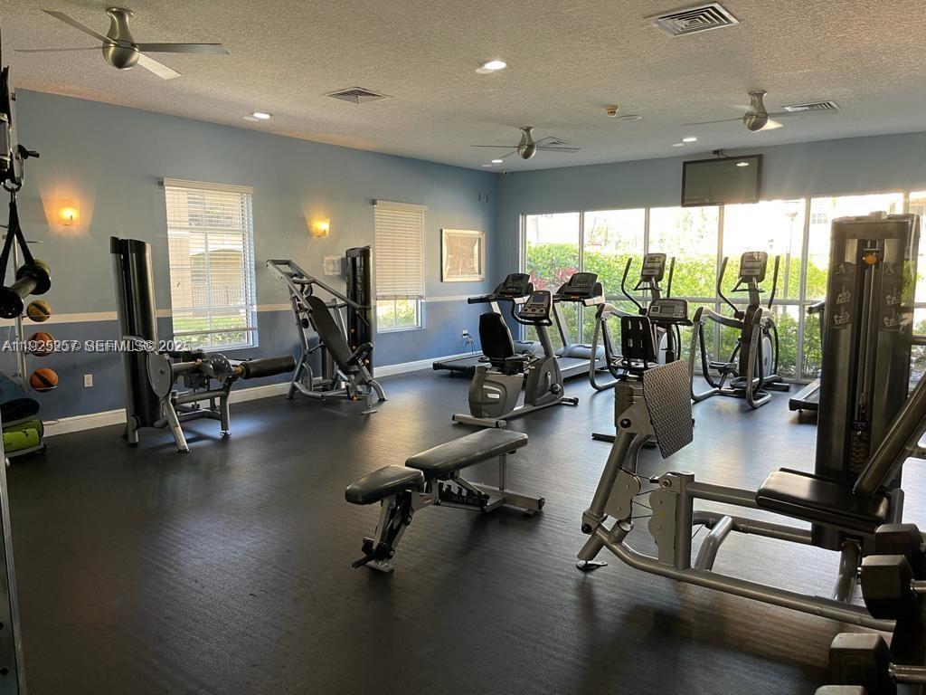 160 Southwest 117th Terrace, Unit 6106 Pembroke Pines, FL 33025 - Photo 17 of 28 a view of a room with gym equipment