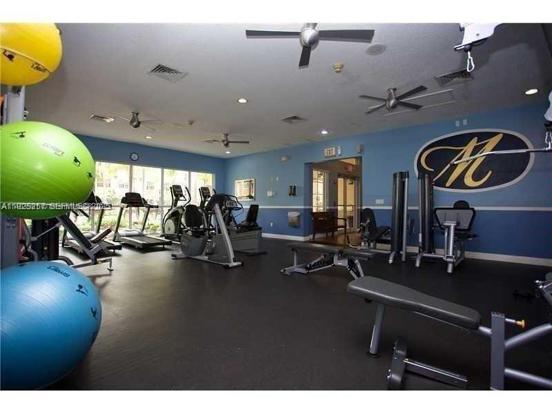 160 Southwest 117th Terrace, Unit 6106 Pembroke Pines, FL 33025 - Photo 18 of 28 a view of a room with gym equipment