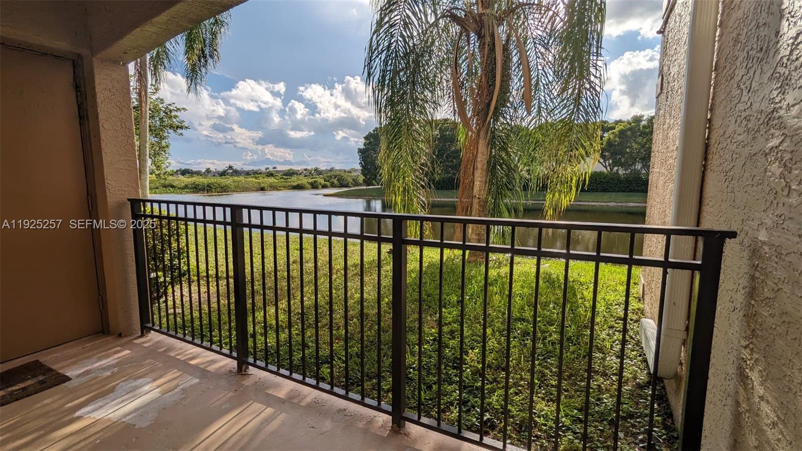 160 Southwest 117th Terrace, Unit 6106 Pembroke Pines, FL 33025 - Photo 2 of 28 a view of balcony with a garden