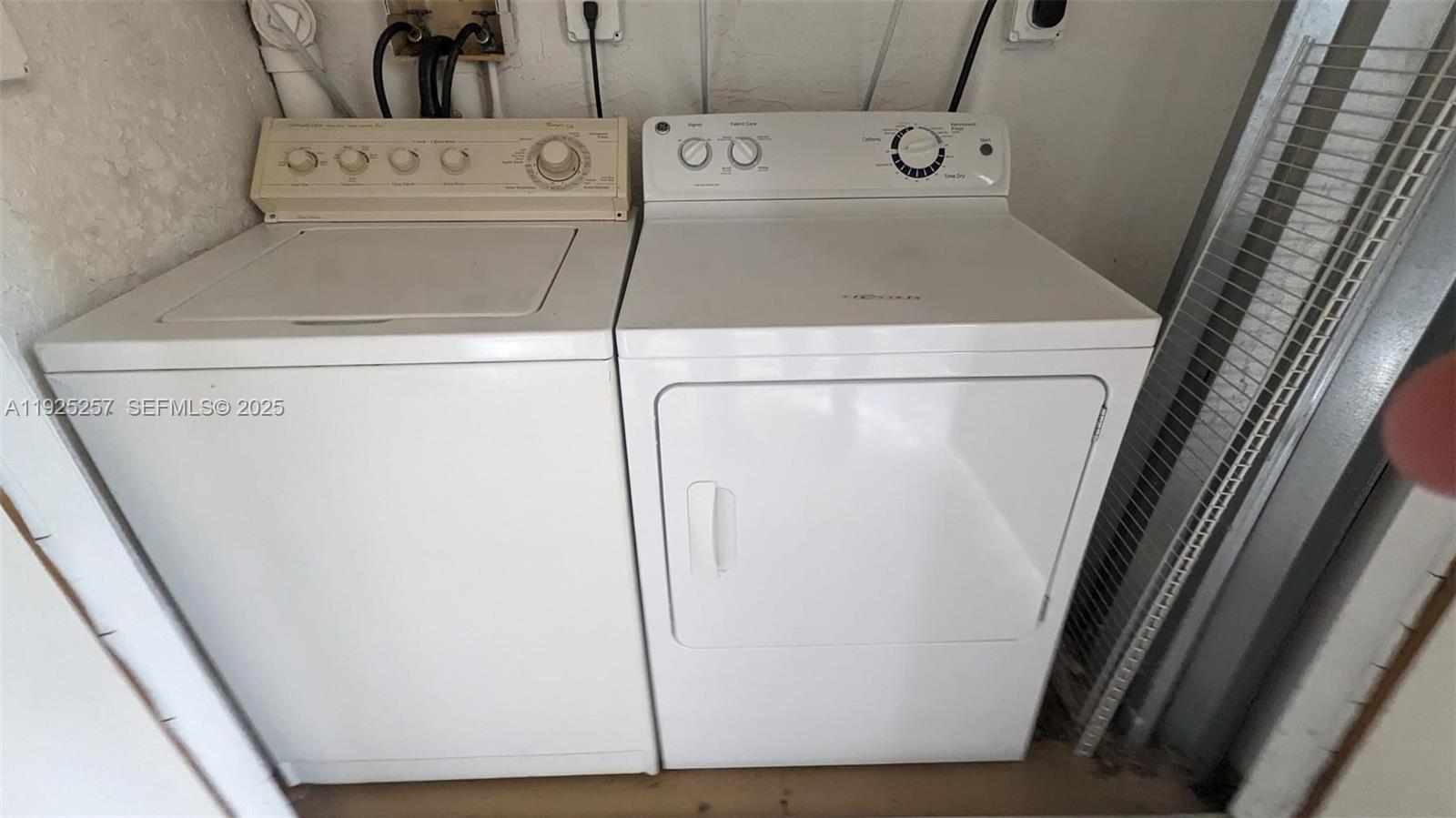 160 Southwest 117th Terrace, Unit 6106 Pembroke Pines, FL 33025 - Photo 28 of 28 a utility room with dryer and washer