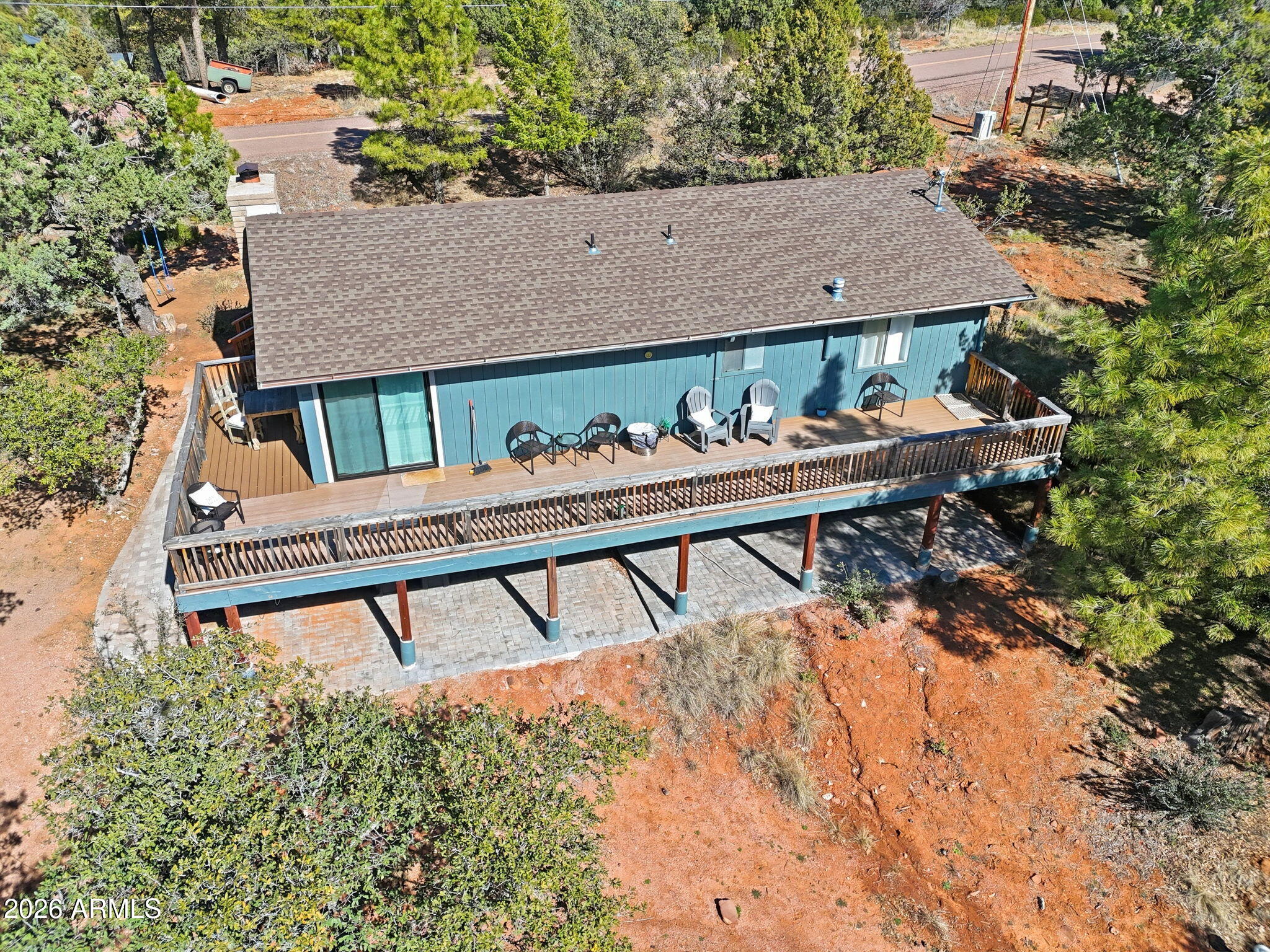 8247 Ralls Drive Pine, AZ 85544 - Photo 31 of 50 a view of a wooden deck and a backyard
