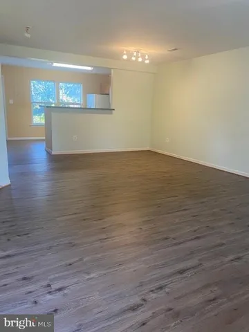 a view of room and wooden floor