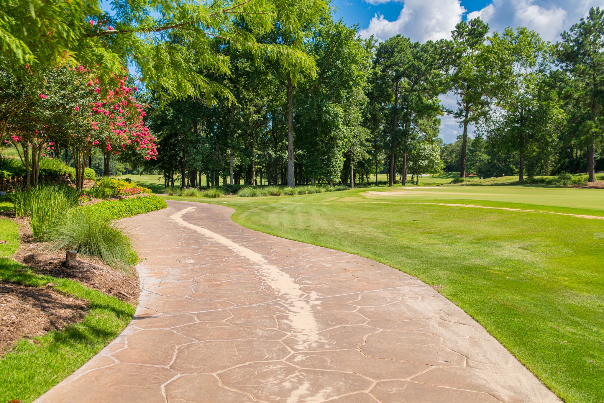 123 Mediterra Way Spring, TX 77389 - Photo 27 of 30 a view of a golf course with a lake