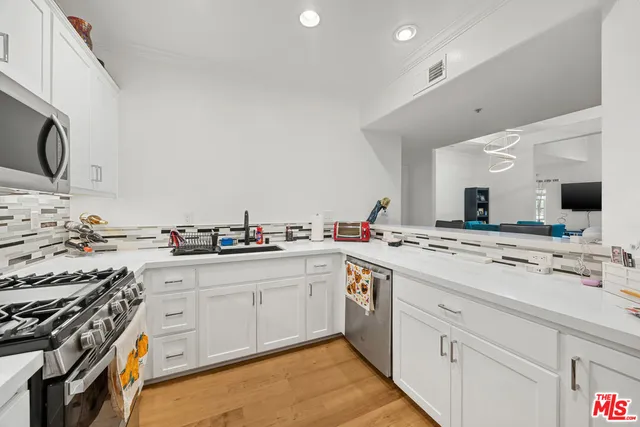 a view of a kitchen with cabinets