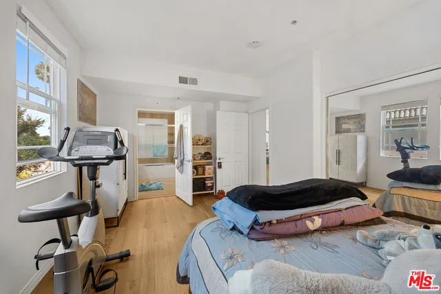 a living room with furniture and a chair