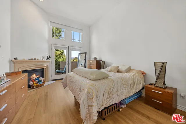 a bedroom with a bed and a fireplace