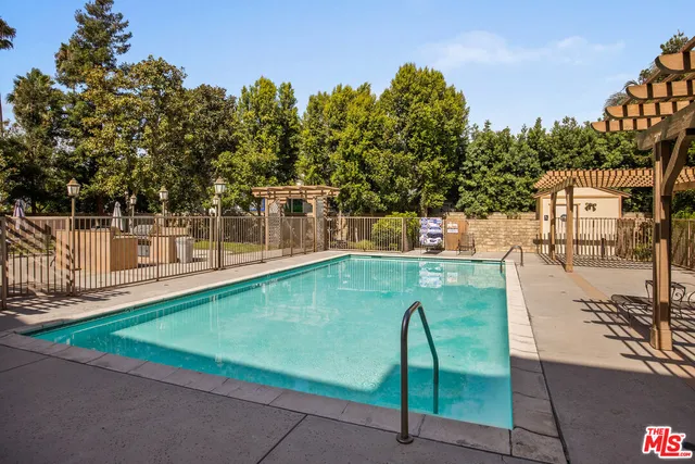 a view of a swimming pool with a patio