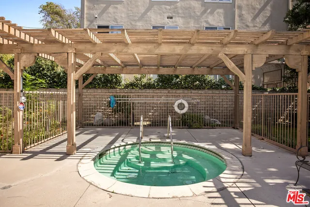 a view of a swimming pool with a patio
