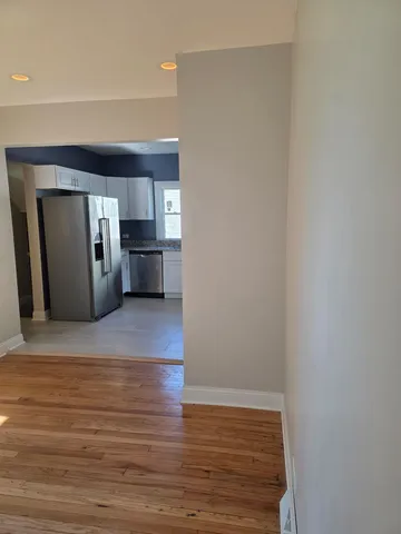 a view of a livingroom with a kitchen