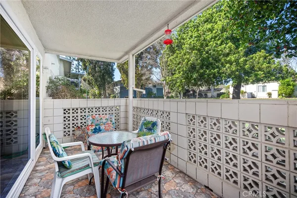 a view of a table and chairs in the patio