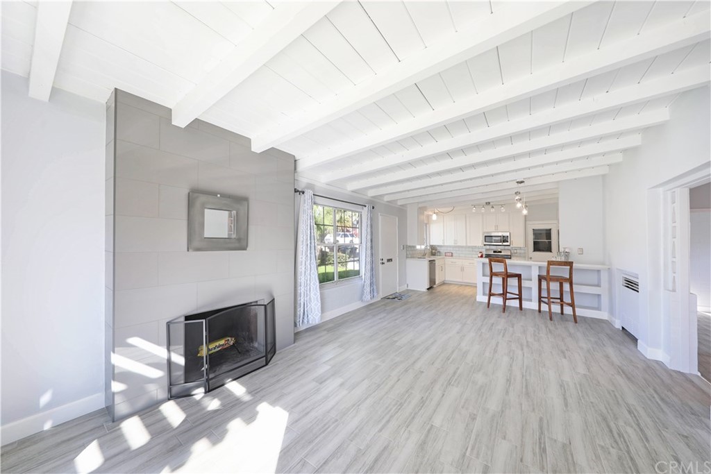 145 Avenida Mateo San Clemente, CA 92672 - Photo 5 of 10 a living room with furniture and a fireplace