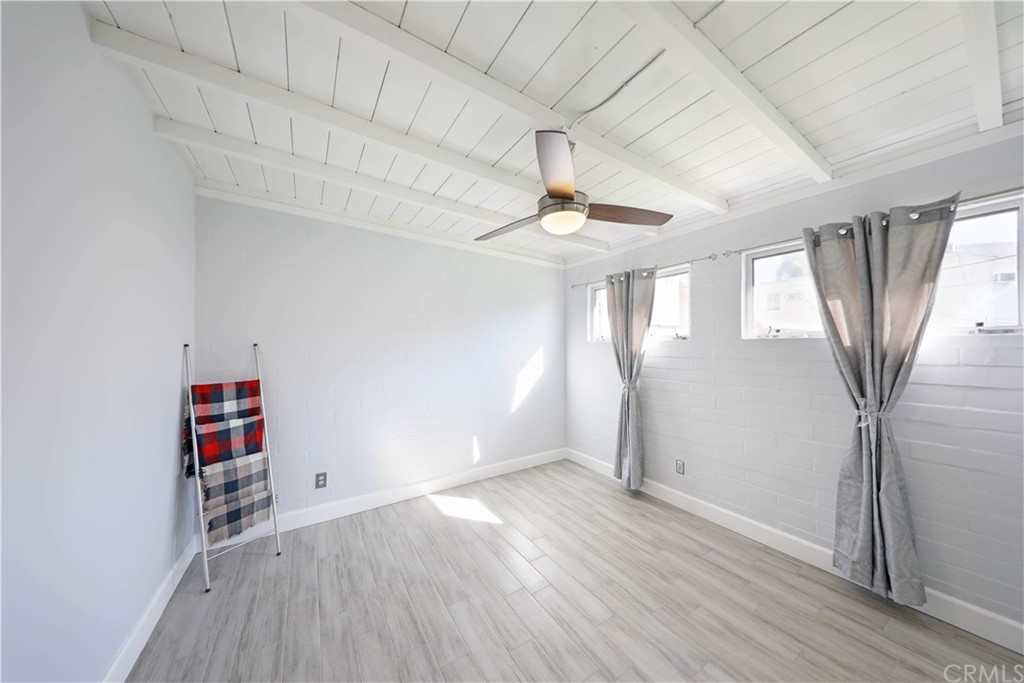 145 Avenida Mateo San Clemente, CA 92672 - Photo 6 of 10 an empty room with wooden floor and window