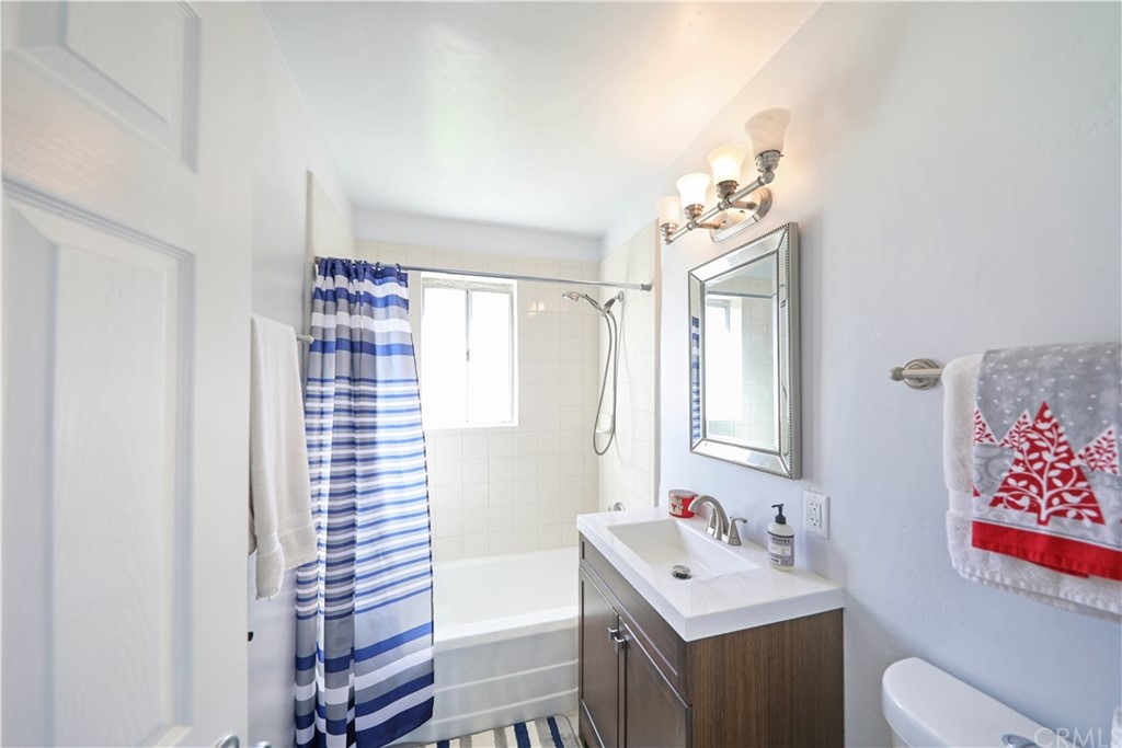 145 Avenida Mateo San Clemente, CA 92672 - Photo 7 of 10 a bathroom with a sink toilet vanity and tub
