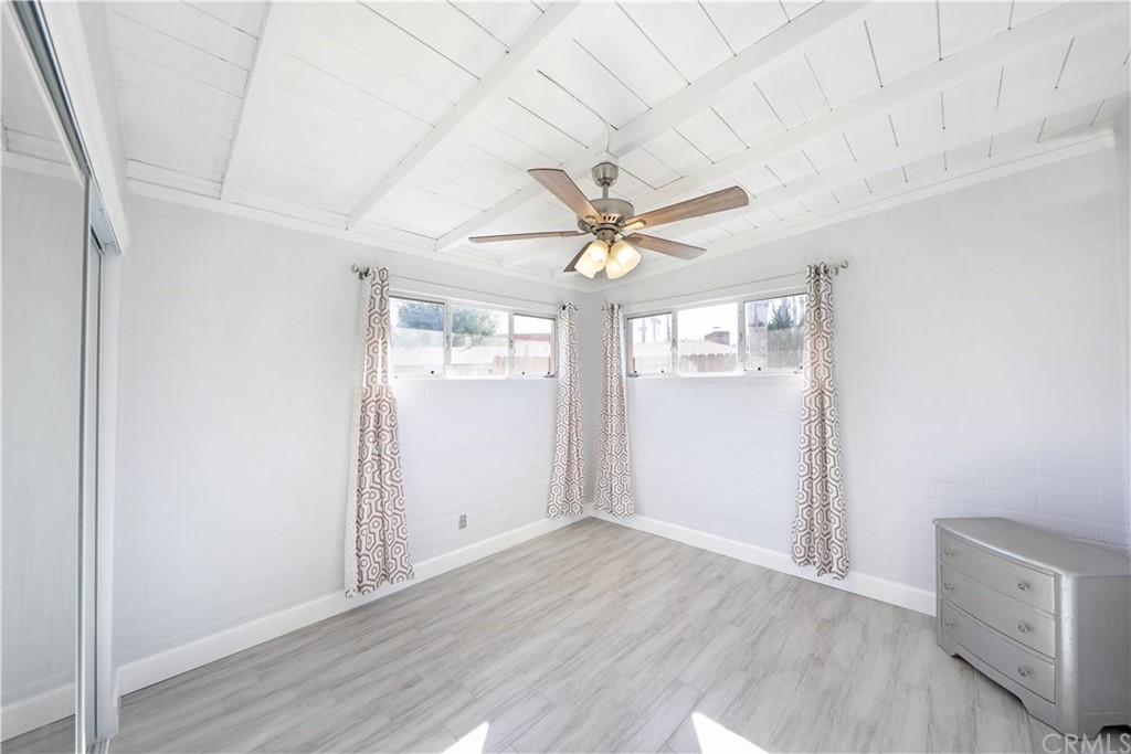 145 Avenida Mateo San Clemente, CA 92672 - Photo 8 of 10 an empty room with wooden floor chandelier and windows