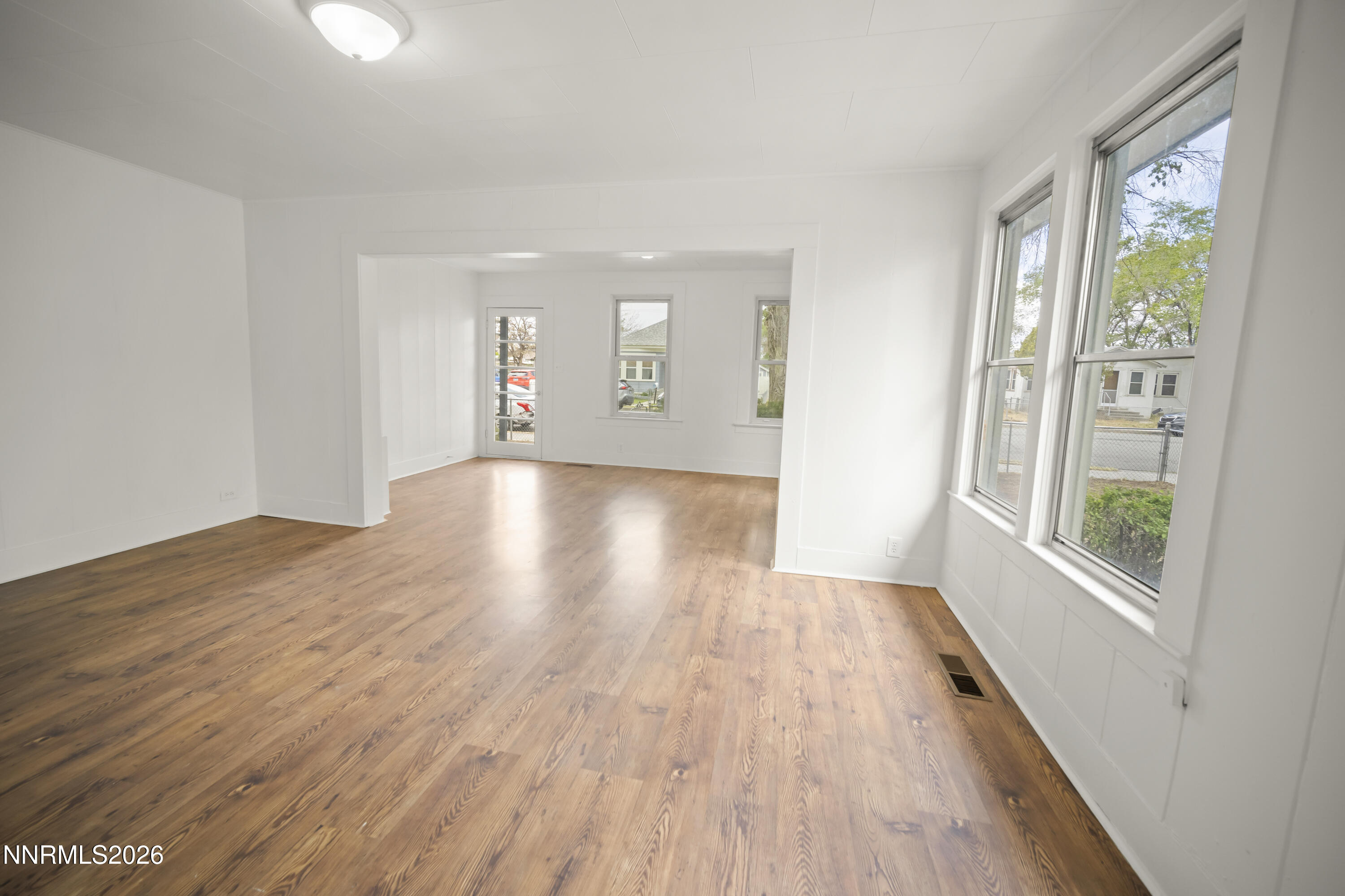 511 Churchill Street Fallon, NV 89406 - Photo 20 of 37 wooden floor in an empty room with a window