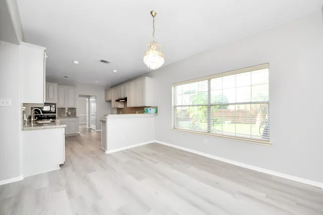 a bathroom with a sink a vanity and a mirror