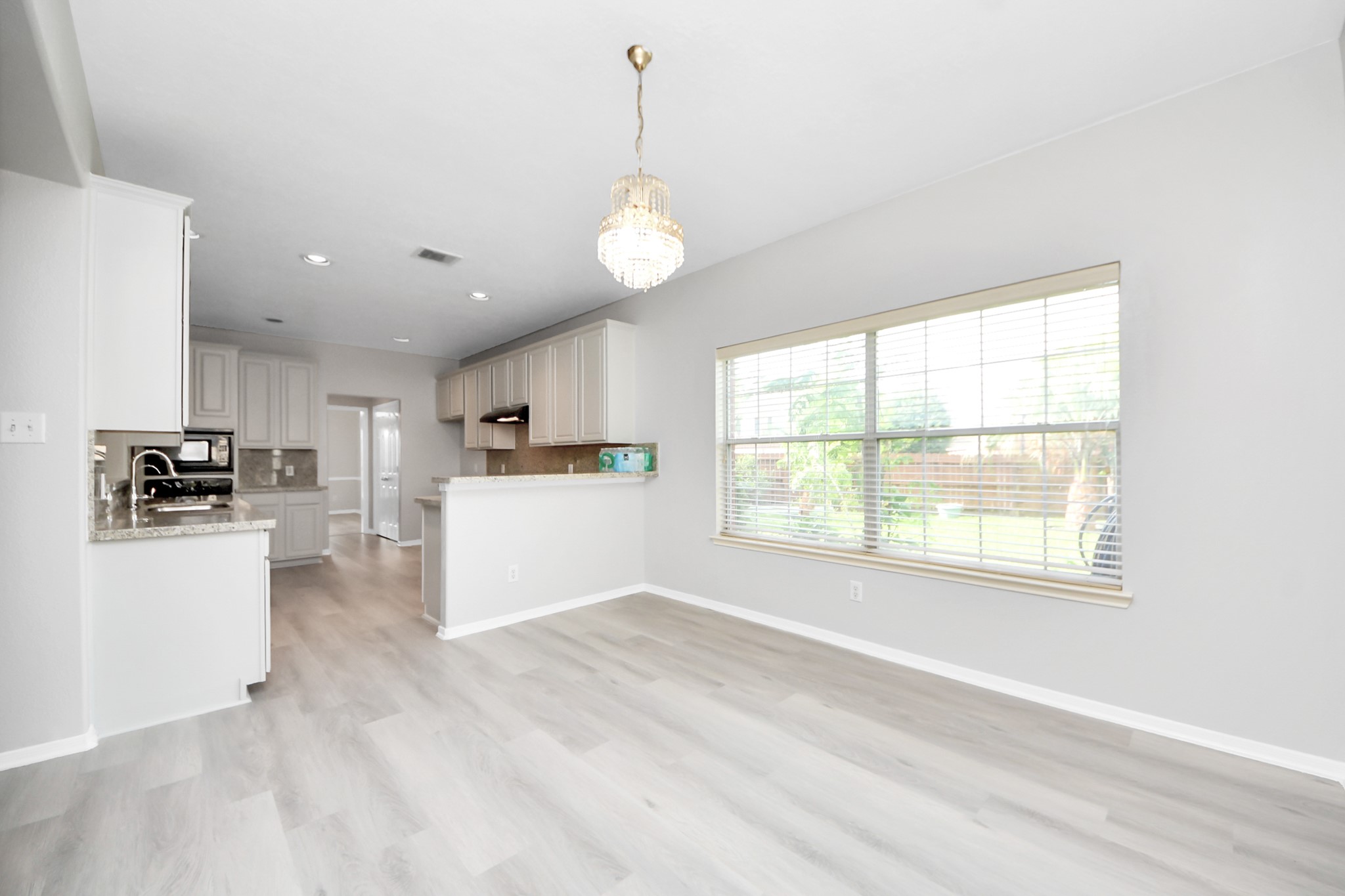 6803 Chapelfield Lane Houston, TX 77049 - Photo 20 of 50 a view of a kitchen with microwave and cabinets