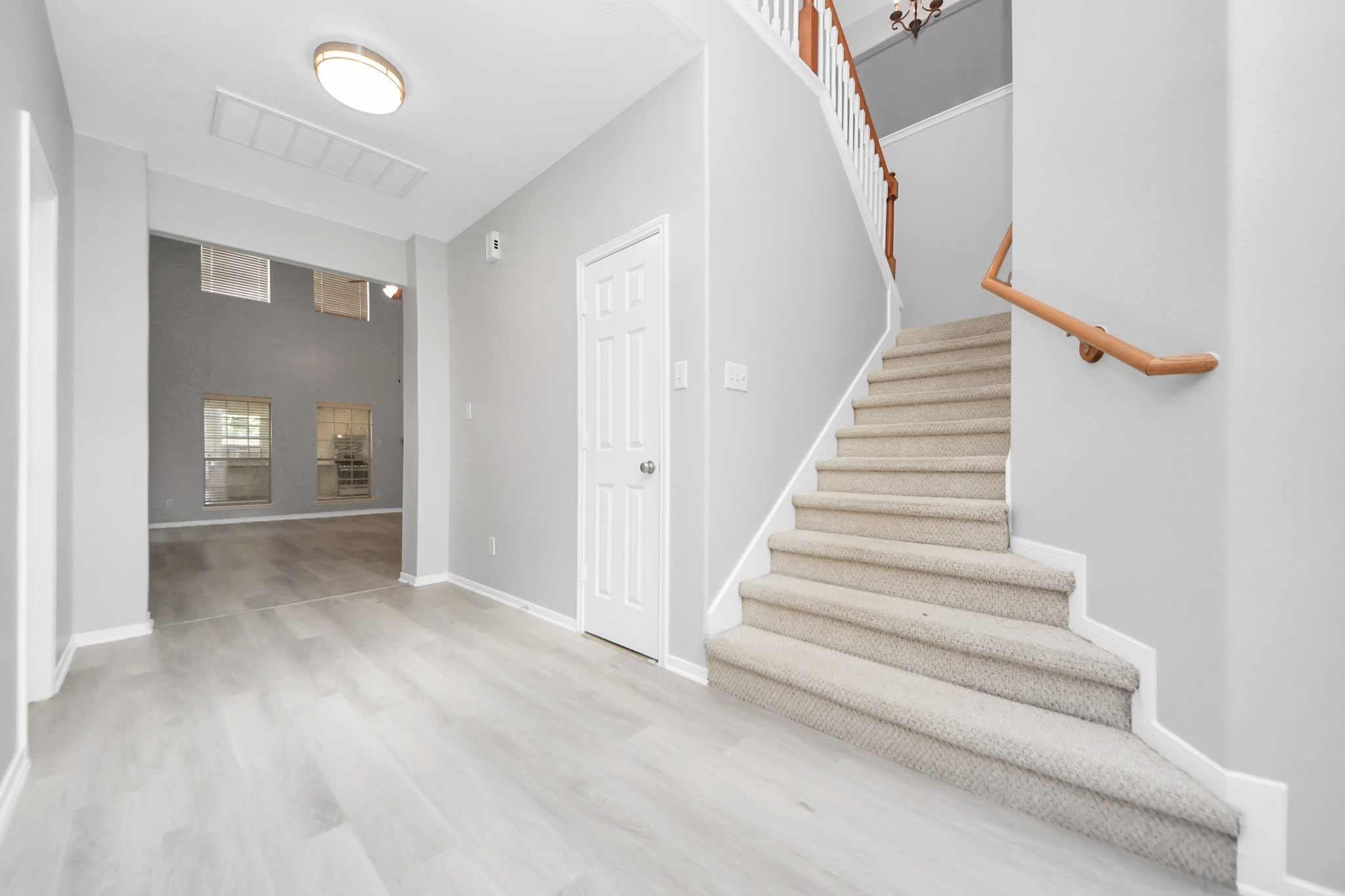 6803 Chapelfield Lane Houston, TX 77049 - Photo 24 of 50 a view of entryway and hall with wooden floor