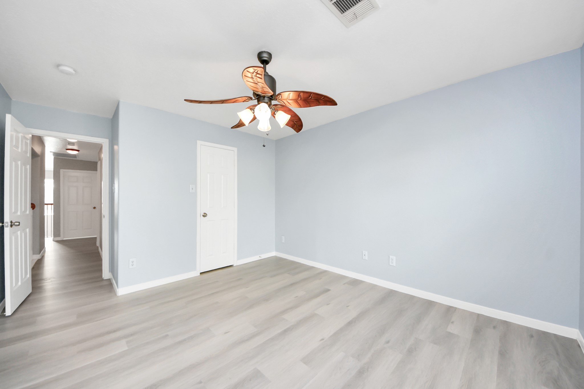 6803 Chapelfield Lane Houston, TX 77049 - Photo 31 of 50 a view of an empty room and wooden floor