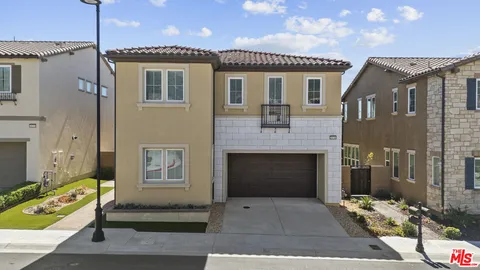 a front view of a house with a tub