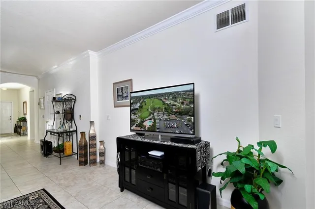 a living room with furniture and a rug