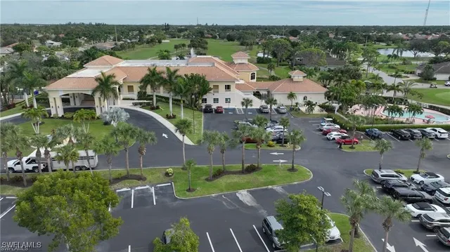 an aerial view of a house with yard swimming pool and outdoor seating