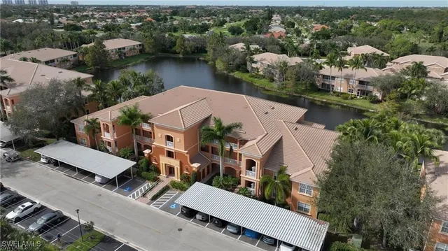 an aerial view of multiple houses with yard