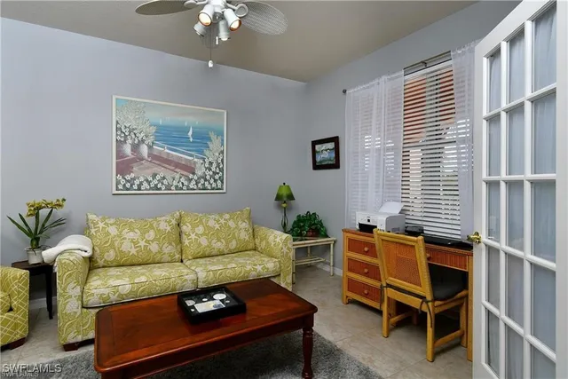 a living room with furniture and a window