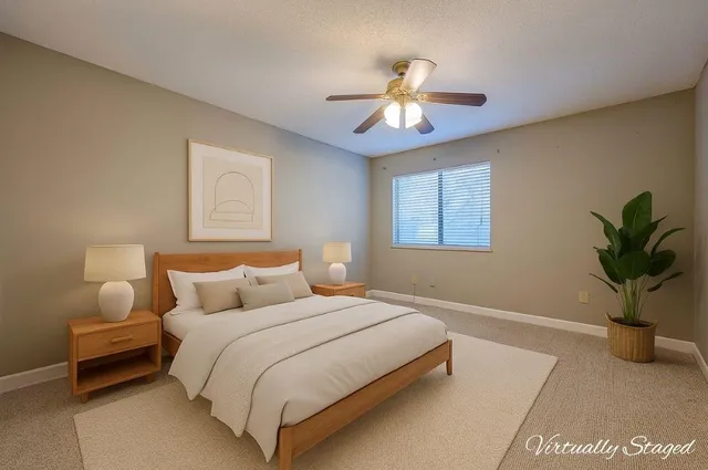 an empty room with a fan and a fan