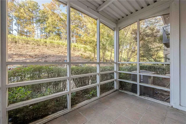 a room with walk in closet and window