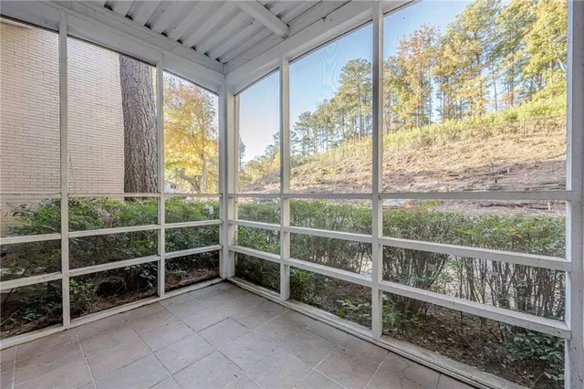 a view of a patio with swimming pool table and chairs