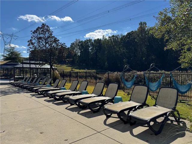 a building outdoor space with patio furniture and potted plants